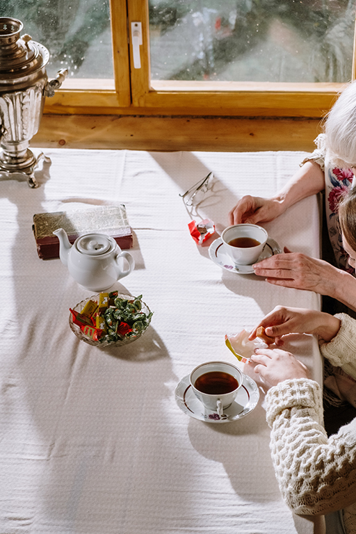 two people having tea at a table